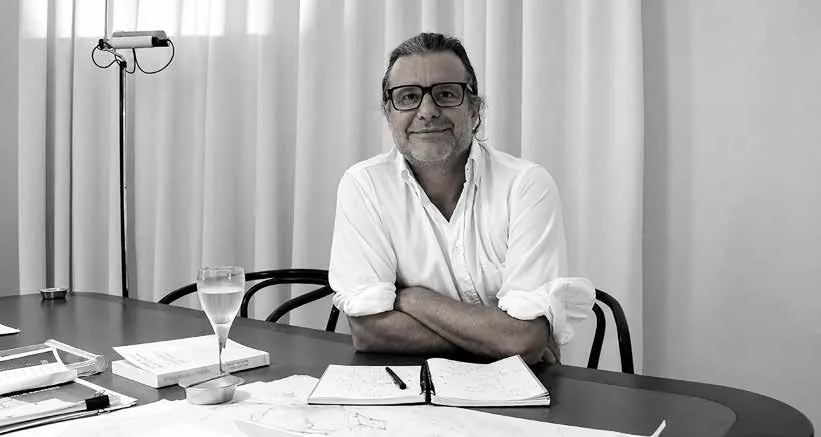 Ricardo E. Bofill, architect of Brigade Barcelona, at his desk — black-and-white portrait from the Brigade Barcelona brochure