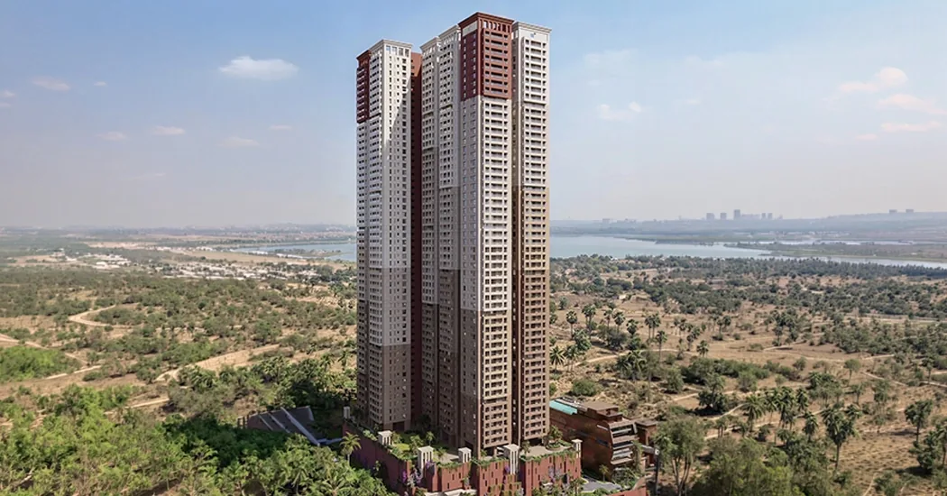 Brigade Barcelona — aerial view of the single lake-facing tower from the south, with the Kokapet plateau behind