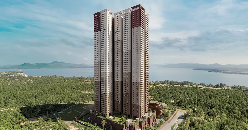 Brigade Barcelona — aerial view of the single lake-facing tower against the lake and the Neopolis layout, Kokapet